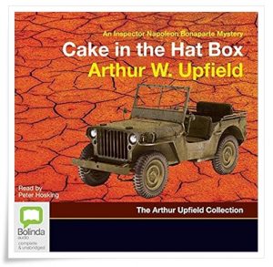 Book cover: “Sinister Stones” by Arthur W. Upfield (Doubleday, 1954); reissued as “Cake in the Hat Box”; audiobook read by Peter Hosking (Bolinda, 2018)